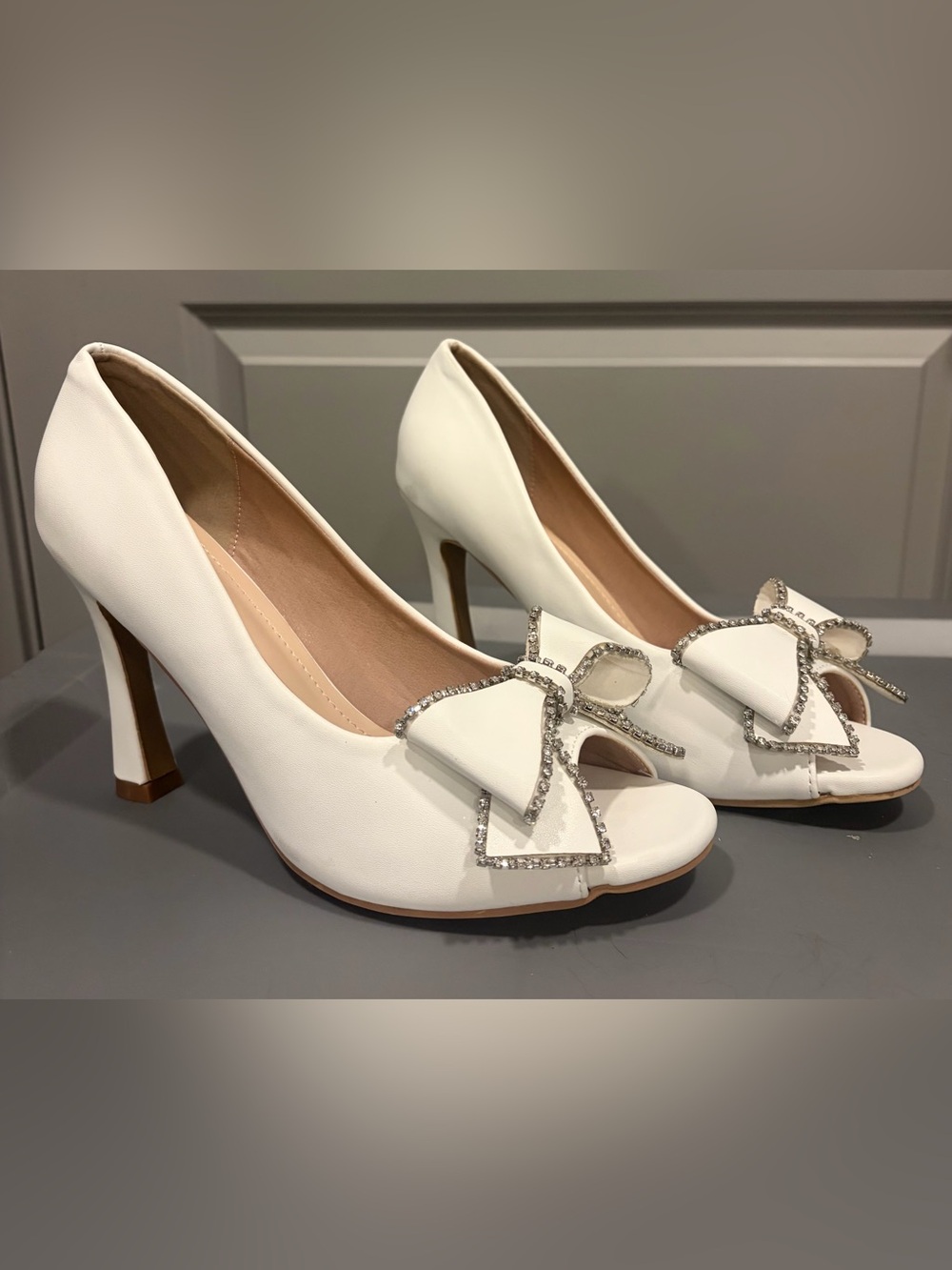 Elegant White Peep-Toe Heels with Crystal Bow